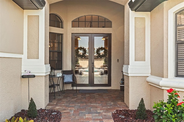 view of exterior entry featuring french doors