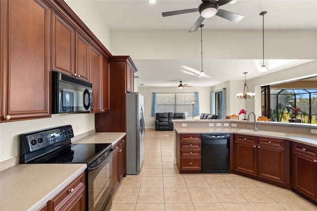 kitchen with pendant lighting, light tile patterned floors, sink, black appliances, and ceiling fan with notable chandelier