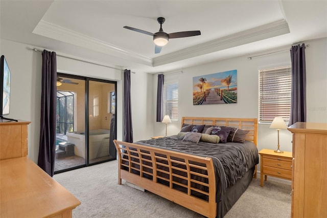 carpeted bedroom with crown molding, ceiling fan, access to exterior, and a raised ceiling