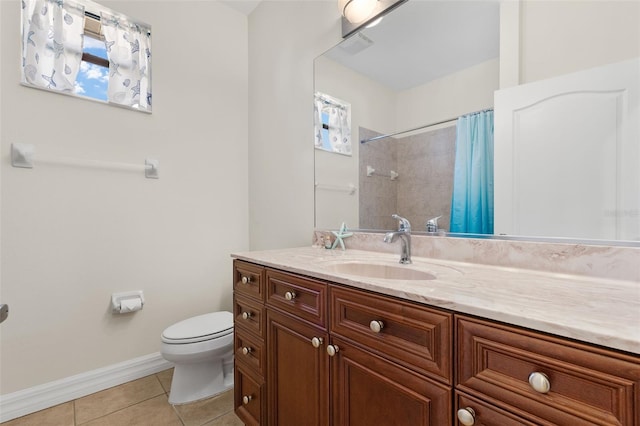 bathroom featuring vanity, a shower with shower curtain, tile patterned floors, and toilet