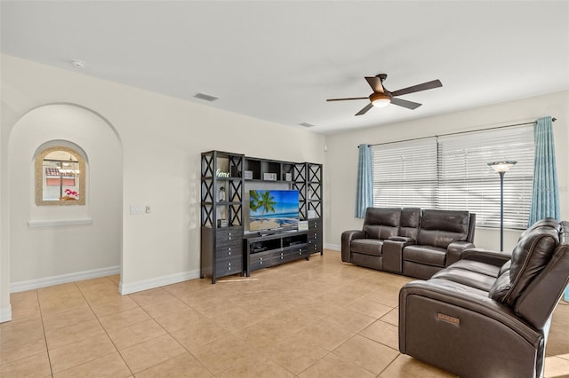 living room with light tile patterned floors and ceiling fan