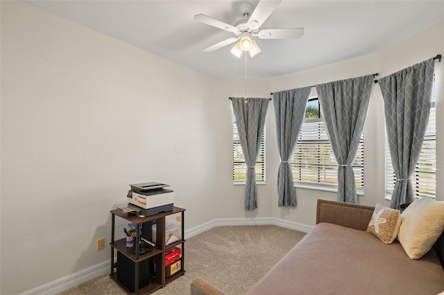 sitting room with carpet floors and ceiling fan