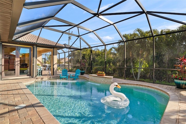 view of swimming pool featuring french doors, a patio, and glass enclosure