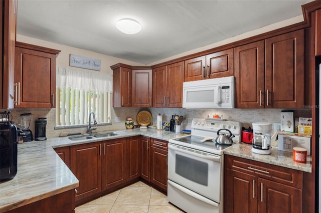 kitchen with sink, backsplash, light tile patterned floors, light stone countertops, and white appliances