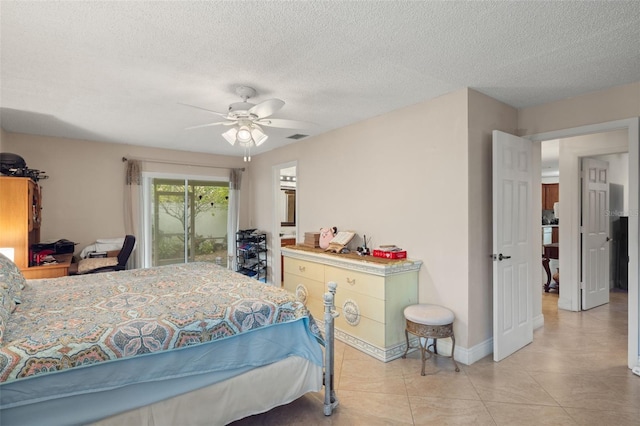 bedroom with access to exterior, light tile patterned floors, a textured ceiling, and ceiling fan