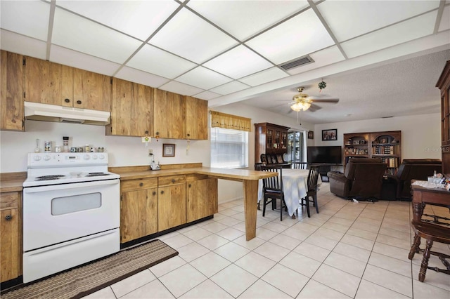 kitchen with electric stove, ceiling fan, a paneled ceiling, and light tile patterned floors