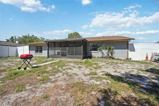 rear view of house with a sunroom