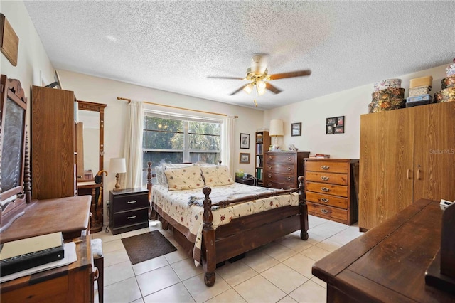 bedroom with light tile patterned floors, a textured ceiling, and ceiling fan