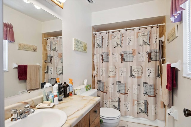 full bathroom featuring vanity, tile patterned floors, toilet, and shower / tub combo with curtain