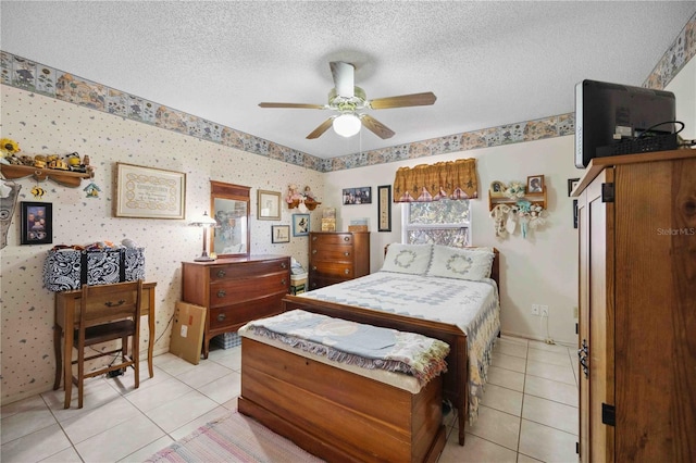 bedroom featuring ceiling fan, a textured ceiling, and light tile patterned flooring