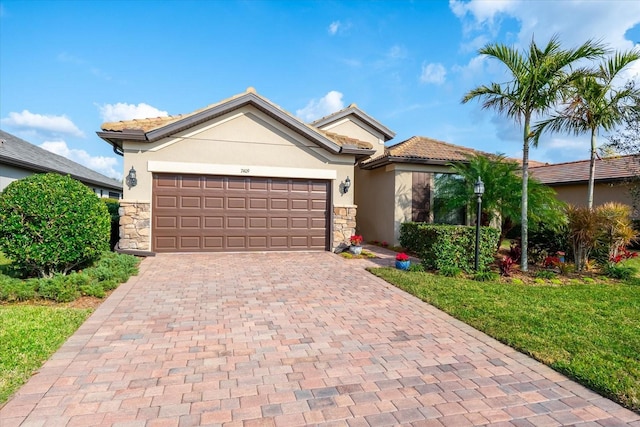 view of front of house with a garage and a front lawn