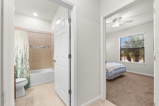 bathroom featuring tile patterned flooring, shower / bath combination with curtain, ceiling fan, and toilet