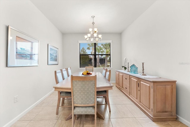 tiled dining space with a notable chandelier