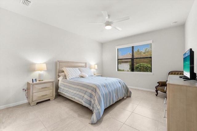 tiled bedroom with ceiling fan