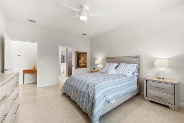 bedroom featuring ceiling fan and ensuite bath