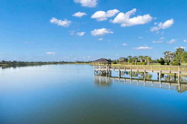 dock area with a gazebo and a water view