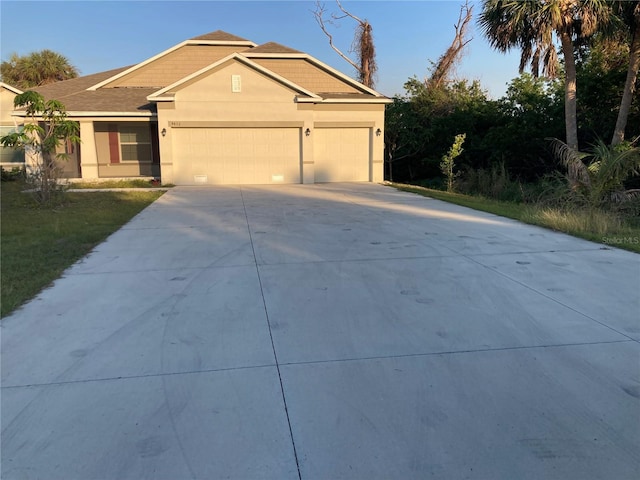 single story home featuring a garage