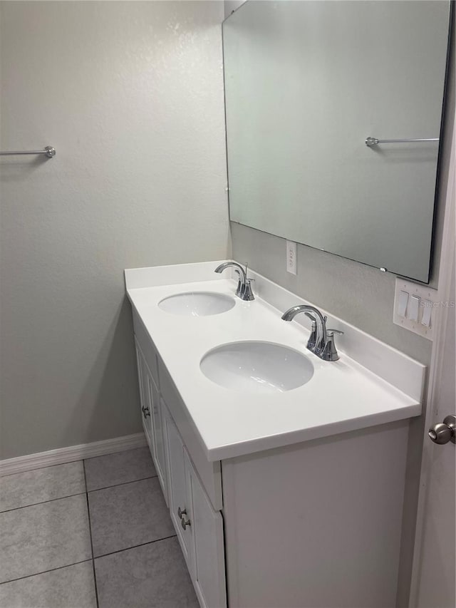 bathroom with tile patterned flooring and vanity