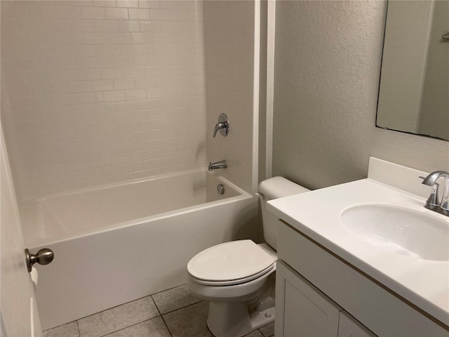 full bathroom with a textured wall, shower / tub combination, toilet, vanity, and tile patterned floors