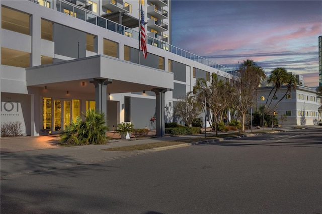 view of outdoor building at dusk