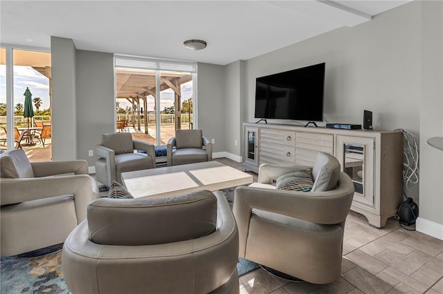 living room with a wall of windows and a wealth of natural light