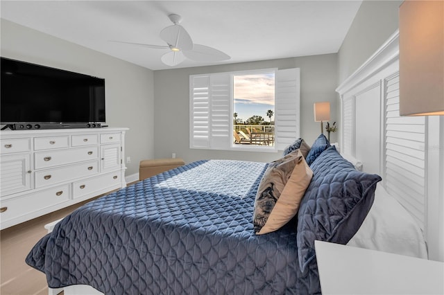 bedroom with hardwood / wood-style flooring and ceiling fan