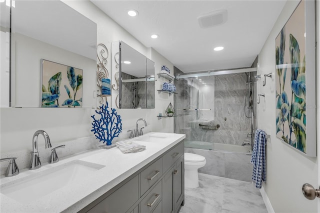 full bathroom with vanity, toilet, and combined bath / shower with glass door