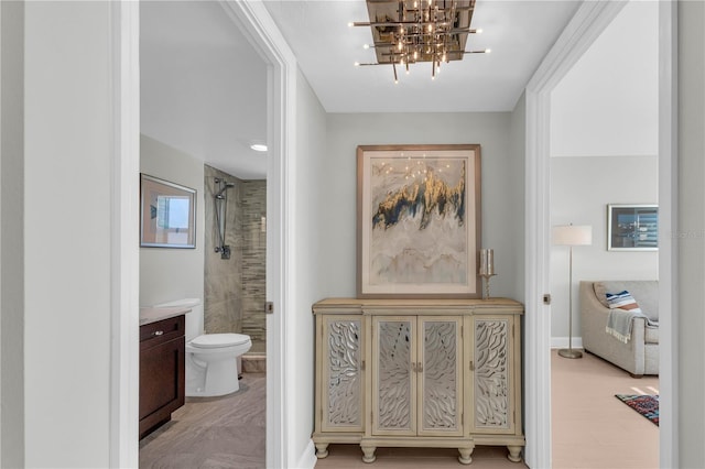 hallway with a chandelier