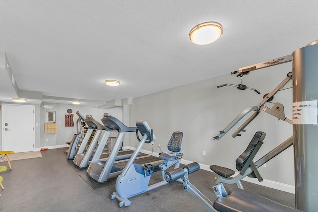 workout area with a textured ceiling