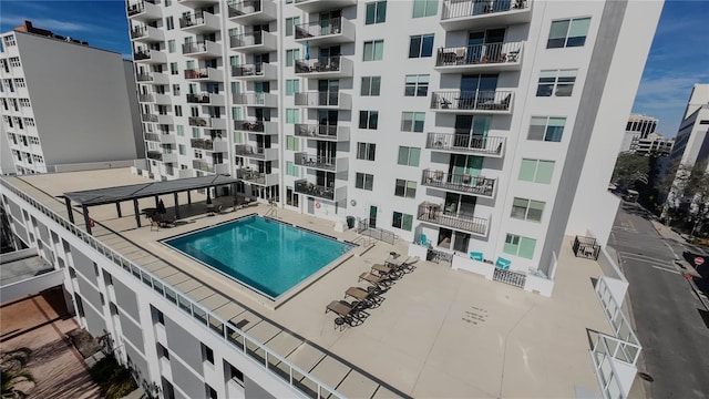 view of swimming pool with a patio