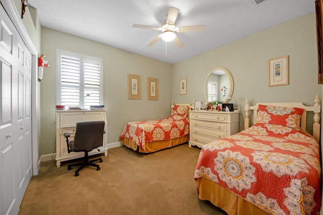 bedroom featuring light carpet, a closet, and ceiling fan