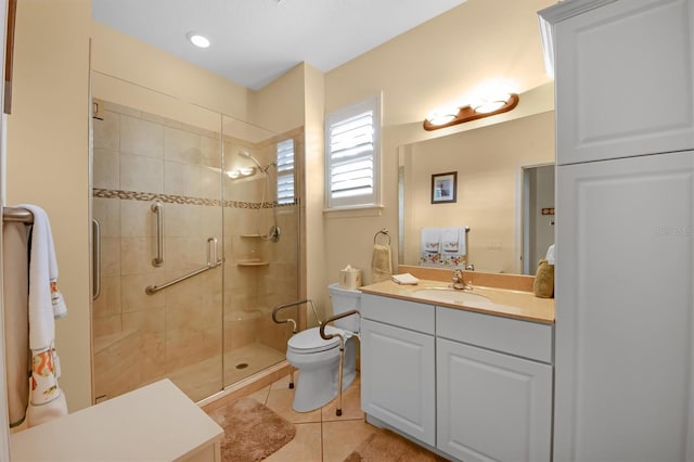 bathroom with tile patterned floors, toilet, an enclosed shower, and vanity