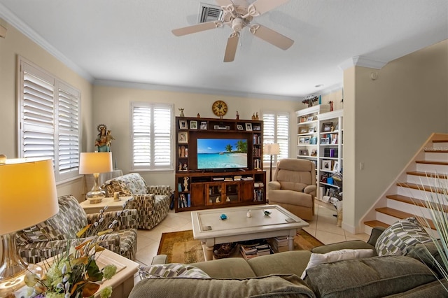 tiled living room with ceiling fan and ornamental molding