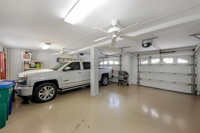 garage with a garage door opener and ceiling fan