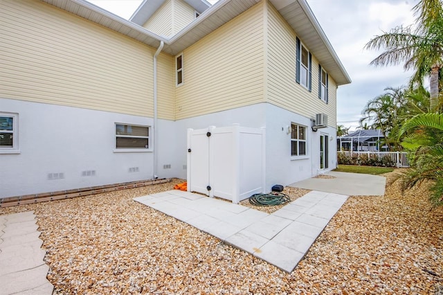 view of side of property with a patio