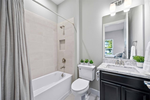 full bathroom featuring toilet, vanity, and shower / bath combo with shower curtain