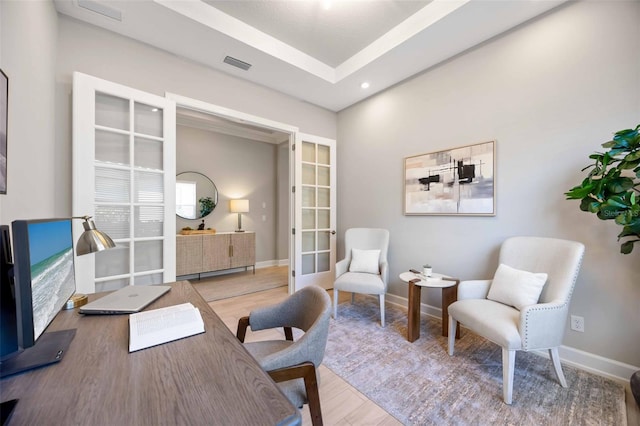 office area with wood-type flooring and french doors