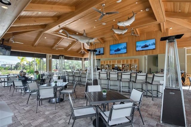 view of patio / terrace featuring a bar, a gazebo, and ceiling fan