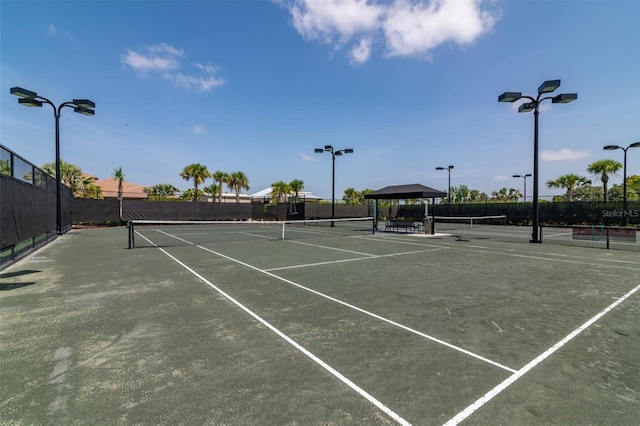 view of tennis court featuring a gazebo