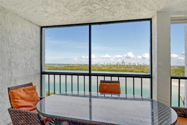 sunroom with a water view