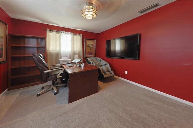 2566 Forest Run Ct, Clearwater, FL 33761 - office area featuring a textured ceiling, carpet, and baseboards