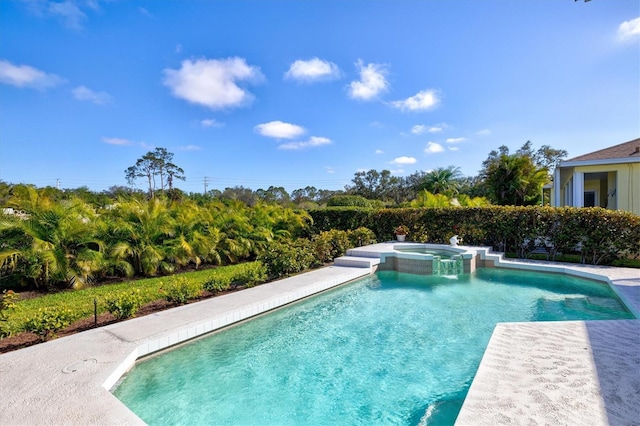 view of swimming pool featuring a pool with connected hot tub