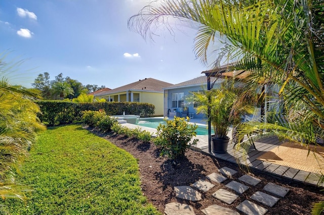 view of yard with a fenced in pool