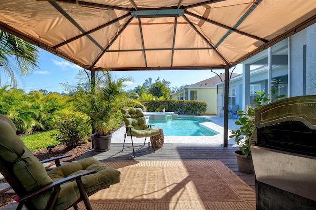 pool featuring a gazebo and a wooden deck