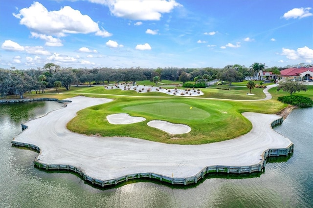 view of community featuring view of golf course and a water view