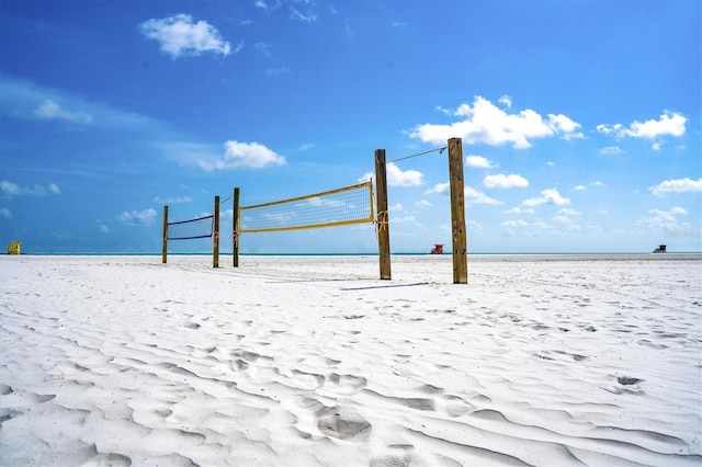 surrounding community featuring a view of the beach and a water view