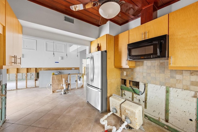 kitchen featuring stainless steel fridge, decorative backsplash, light tile patterned floors, ceiling fan, and wood ceiling