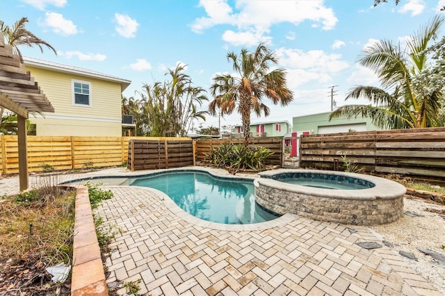 view of pool featuring an in ground hot tub