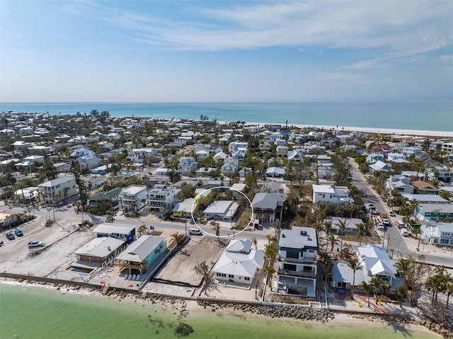 bird's eye view with a view of the beach and a water view