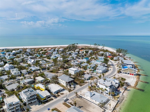 aerial view featuring a view of the beach and a water view